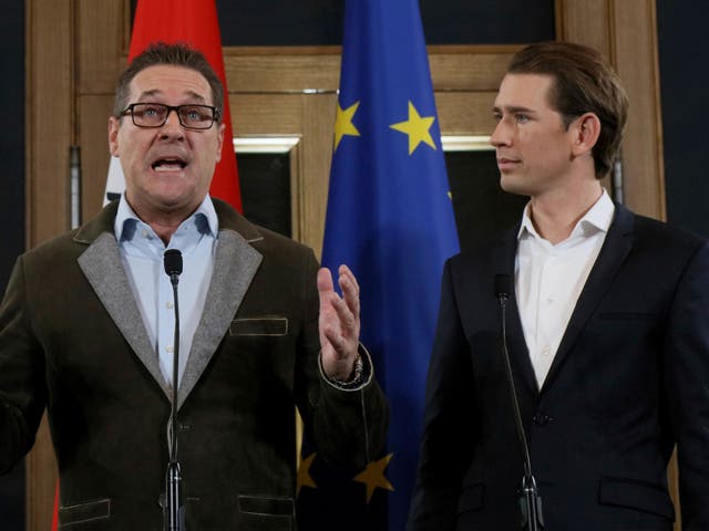 Heinz-Christian Strache (left), chairman of the far-right Freedom Party, and Kurz, foreign minister and leader of the Austrian People's Party, hold a joint news conference after forming the coalition