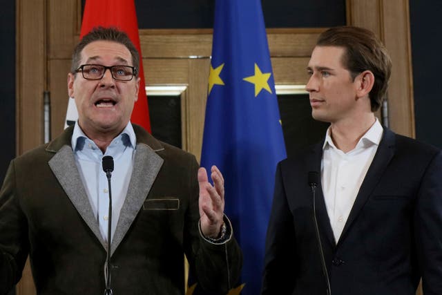 Heinz-Christian Strache (left), chairman of the far-right Freedom Party, and Kurz, foreign minister and leader of the Austrian People's Party, hold a joint news conference after forming the coalition