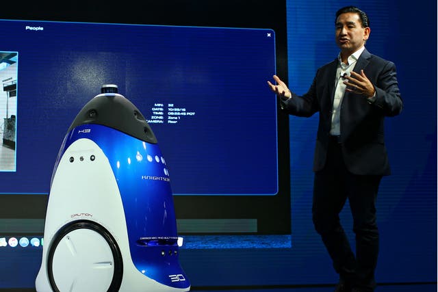 Knightscope Inc. CEO William Santana Li demos a security robot like the one deployed by the SPCA at a conference in Laguna Beach, California