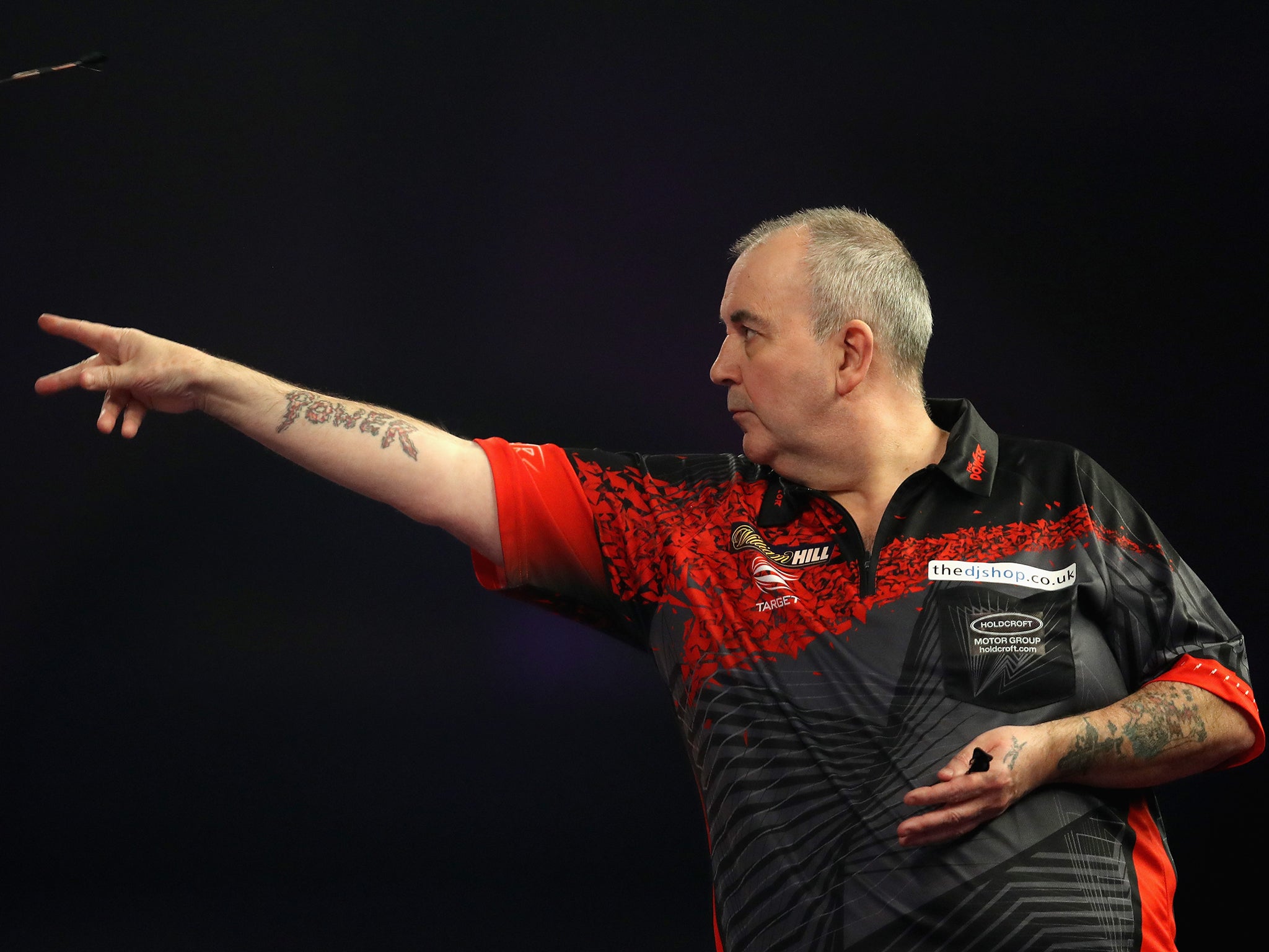 Phil Taylor came through a tight affair against Chris Dobey to reach the second round