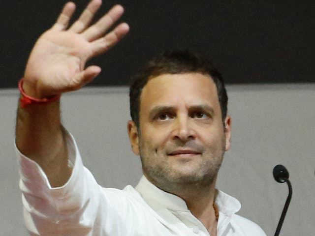 New Congress Party president Rahul Gandhi waves during an election campaign rally