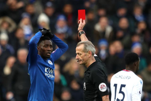 Wilfred Ndidi is sent-off by referee Martin Atkinson after a second booking for diving
