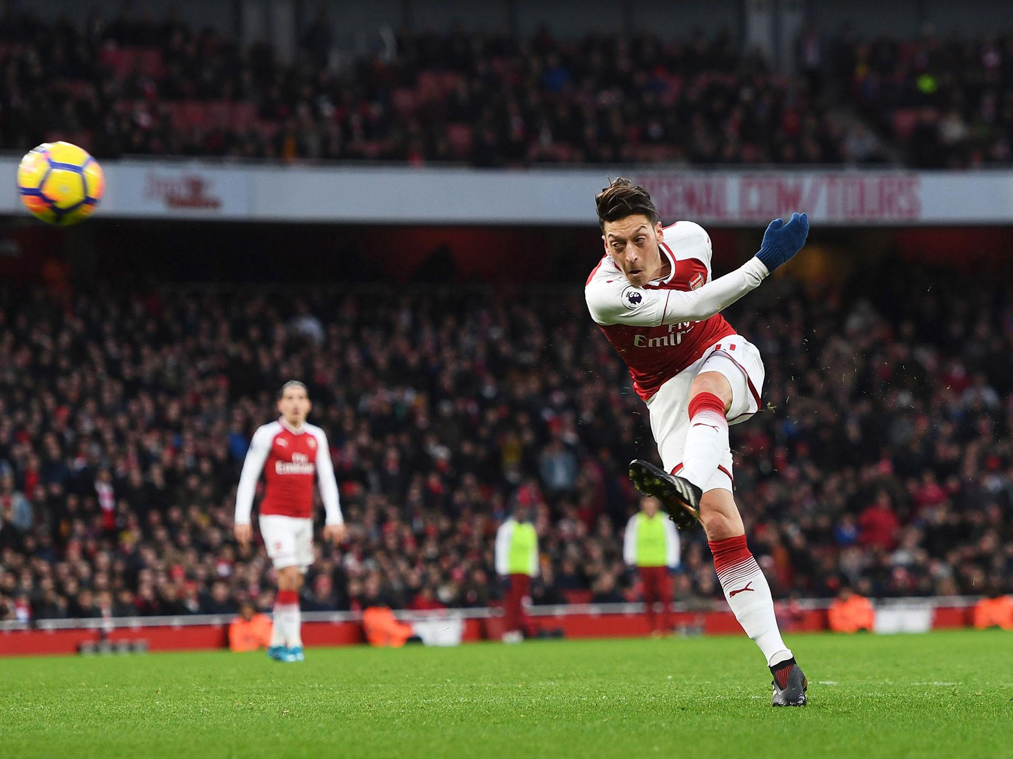 Mesut Ozil's volley secured Arsenal all three points