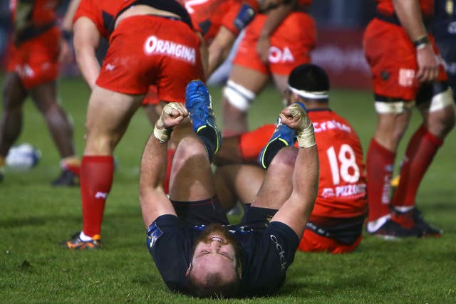 Tom Dunn falls to the floor in celebration after Bath's hard-fought win