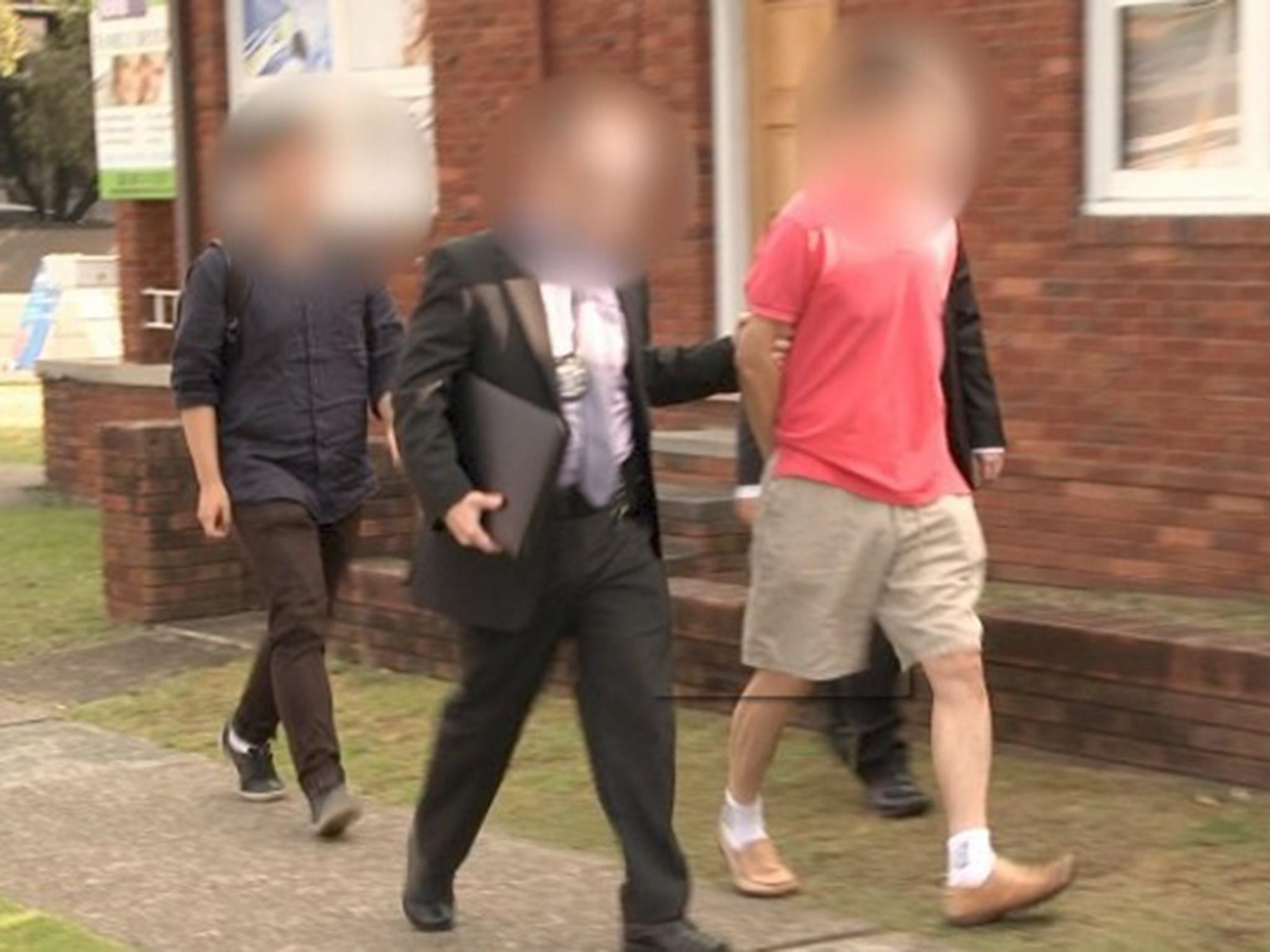 Officers lead away Chan Han Choi