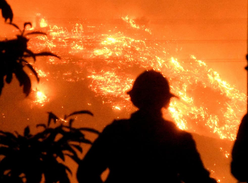 Firefighters keep a close watch on the Thomas wildfire in the hills outside Montecito, California