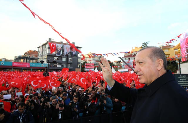 The President greets his supporters during an opening ceremony of a new metro line in Istanbul on 15 December