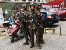 China's Uighur minority shackled by technology as thousands detained