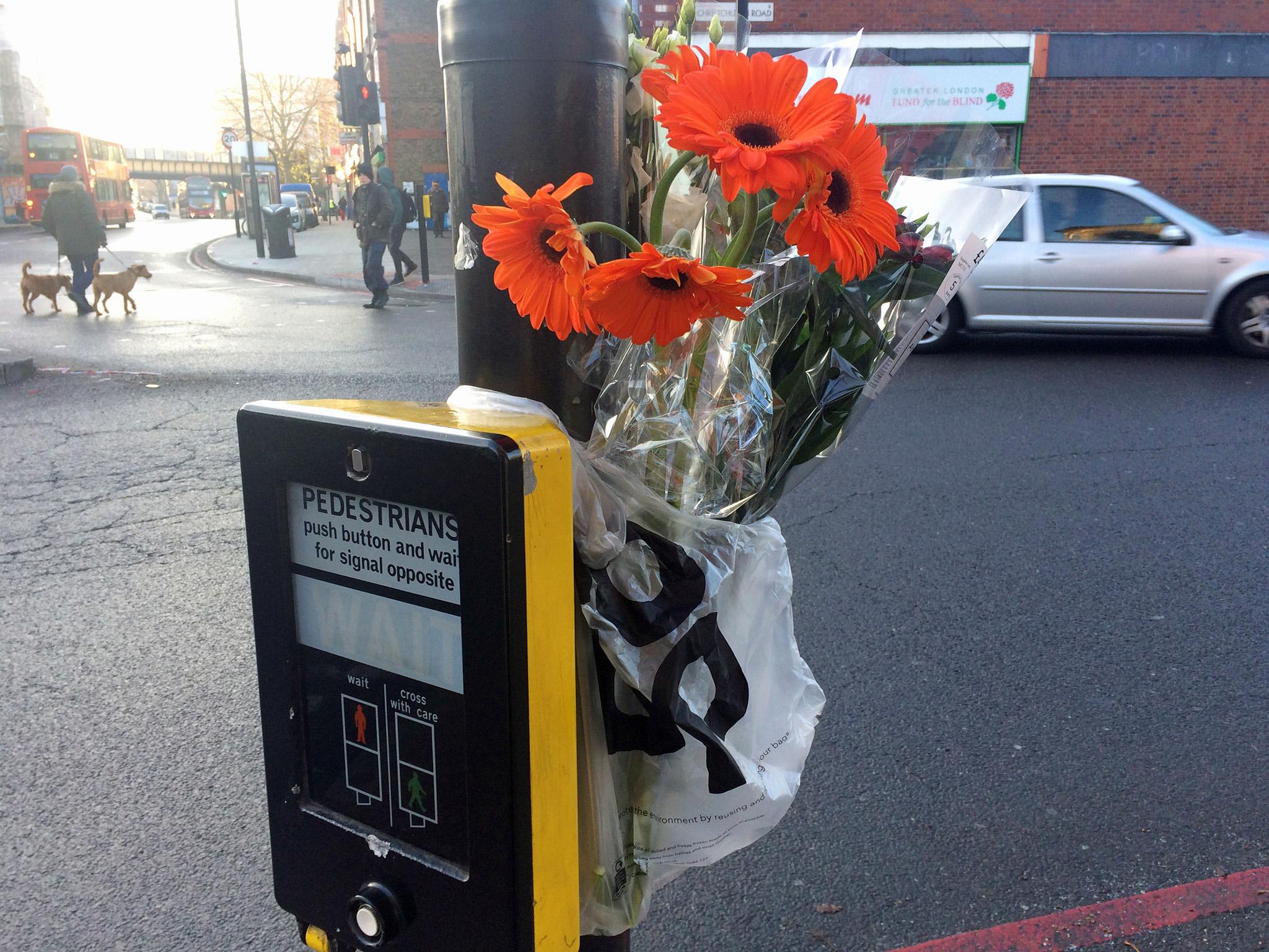 Flowers left at the scene for the woman in Tulse Hill, south London