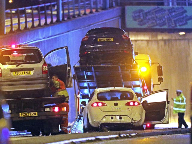 Damaged vehicles are removed from the scene of a multi-vehicle crash at the entrance to the underpass on Lee Bank Middleway, near Edgbaston, at the junction of Bristol Road in Birmingham, which left six people dead and a seventh critically injured