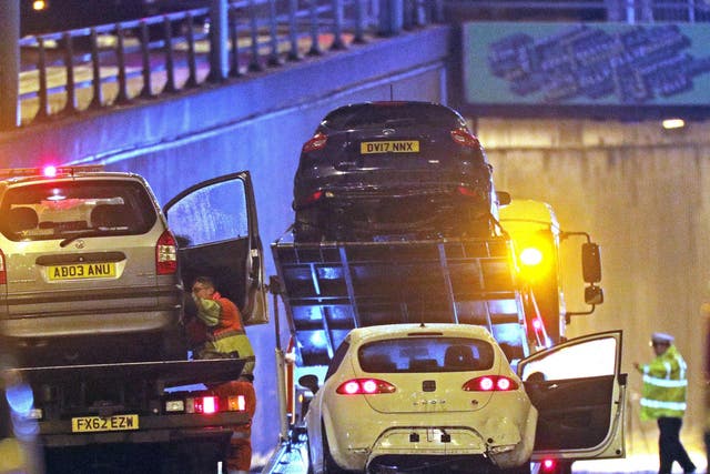 Damaged vehicles are removed from the scene of a multi-vehicle crash at the entrance to the underpass on Lee Bank Middleway, near Edgbaston, at the junction of Bristol Road in Birmingham, which left six people dead and a seventh critically injured
