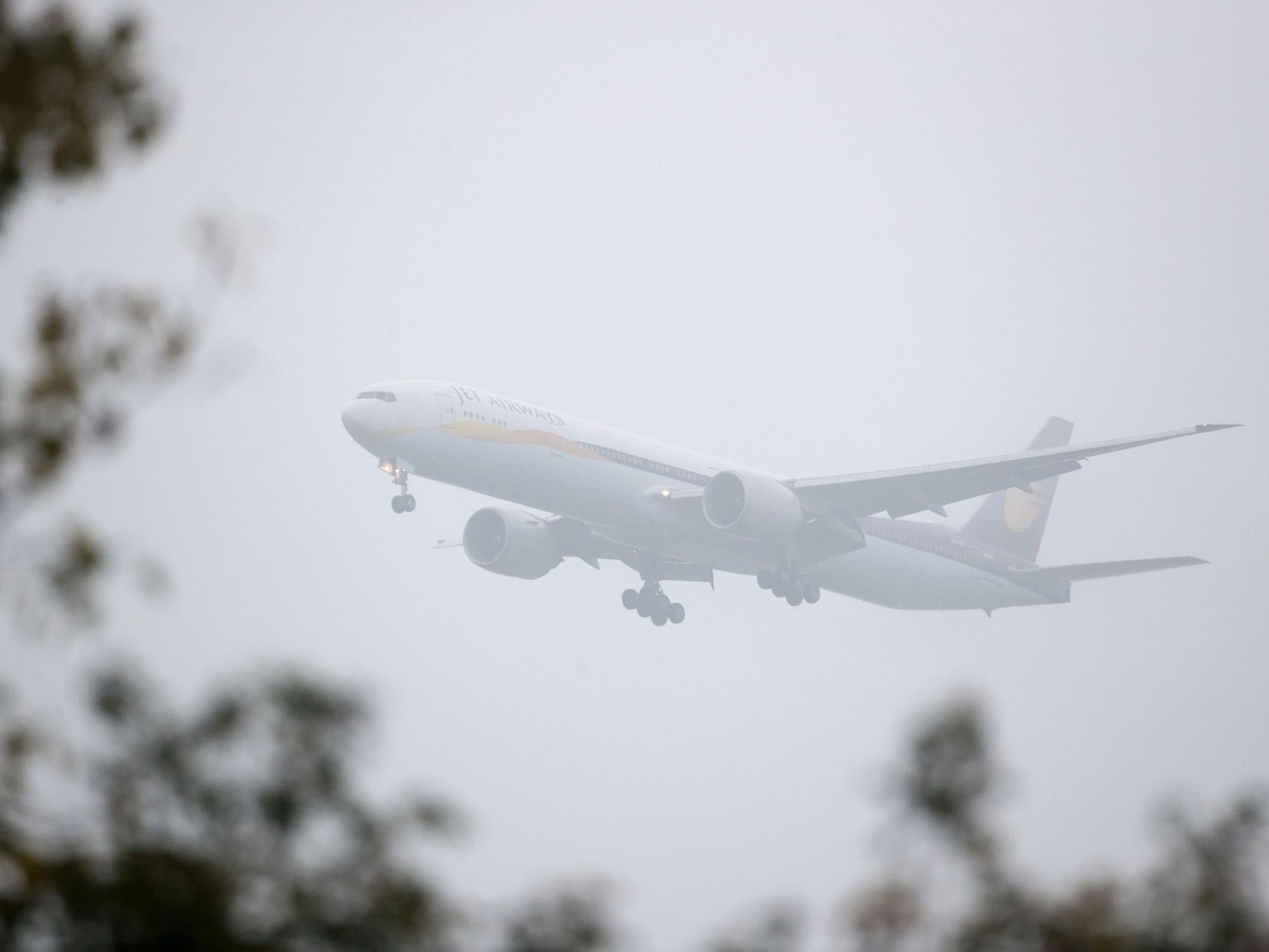 A Jet Airways plane lands in severe fog at Heathrow Airport