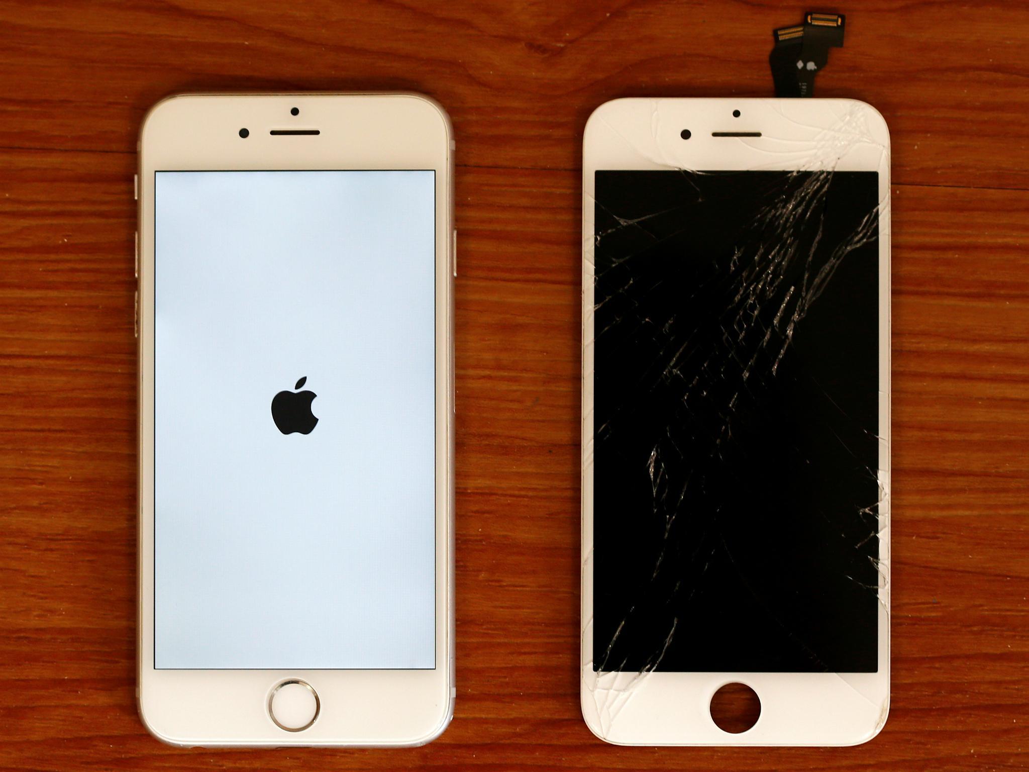 A destroyed iPhone screen and a fixed mobile phone, iPhone 6 by Apple, are pictured in a shop in Fuerstenfeldbruck near Munich, Germany August 16, 2016