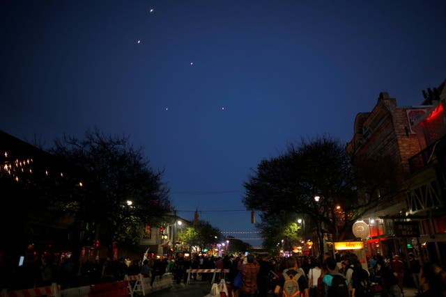 Drones fly over 6th Street to recreate the Phoenix lights UFOs featured in the film "Phoenix Forgotten" during the South by Southwest festival 2017