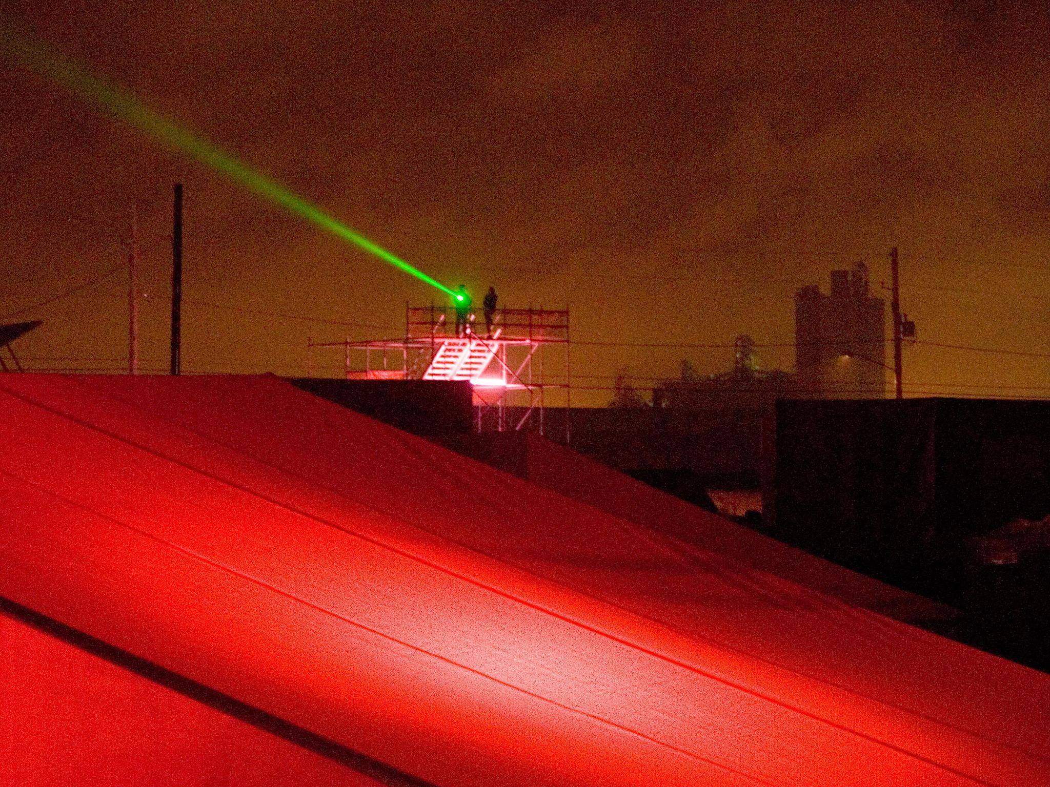A laser pointer shining from a scaffold