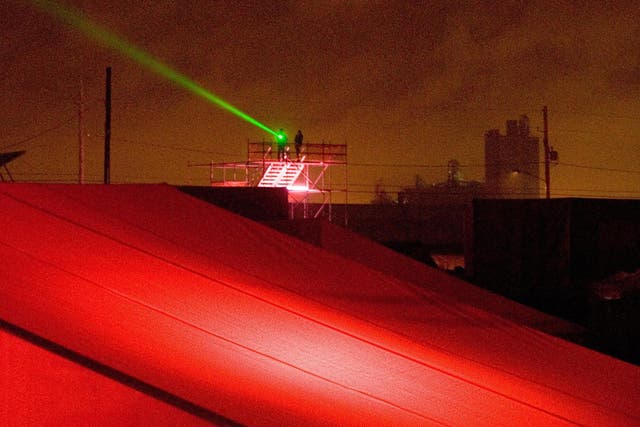 A laser pointer shining from a scaffold
