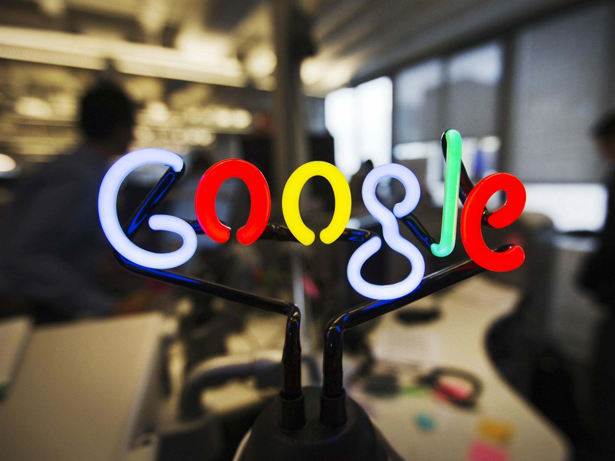 A neon Google logo is seen at the new Google office in Toronto, November 13, 2012