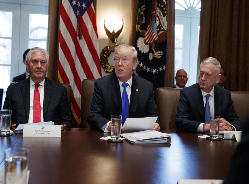Secretary of State Rex Tillerson, left, and Secretary of Defense Jim Mattis, right, listen as President Donald Trump speaks during a cabinet meeting at the White House