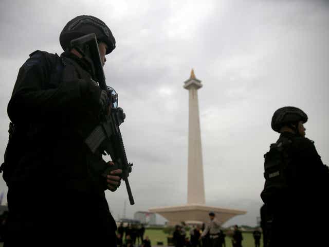 Mobile brigade policemen attend a ceremony ahead of the Christmas and New Year celebrations in Jakarta