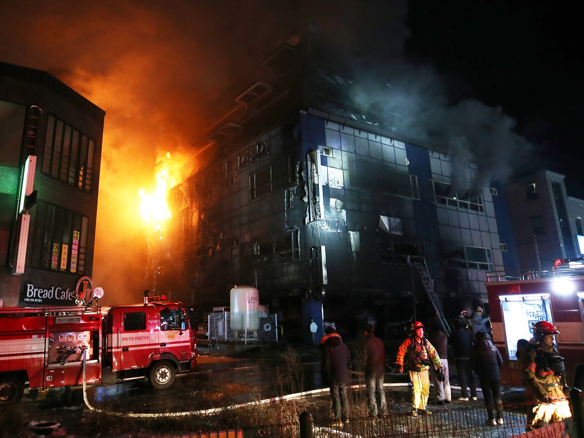 &#13;
Emergency services at the scene where 29 people died and dozens more were injured in a fire that engulfed a commercial building in the southern city of Jecheon &#13;