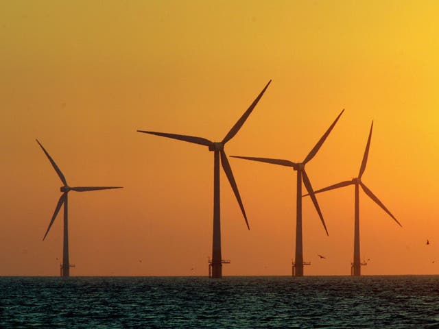 <p>The sun starts to rise behind Britain's largest offshore wind farm off the Great Yarmouth coastline on July 19, 2006 in Norfolk, England.</p>