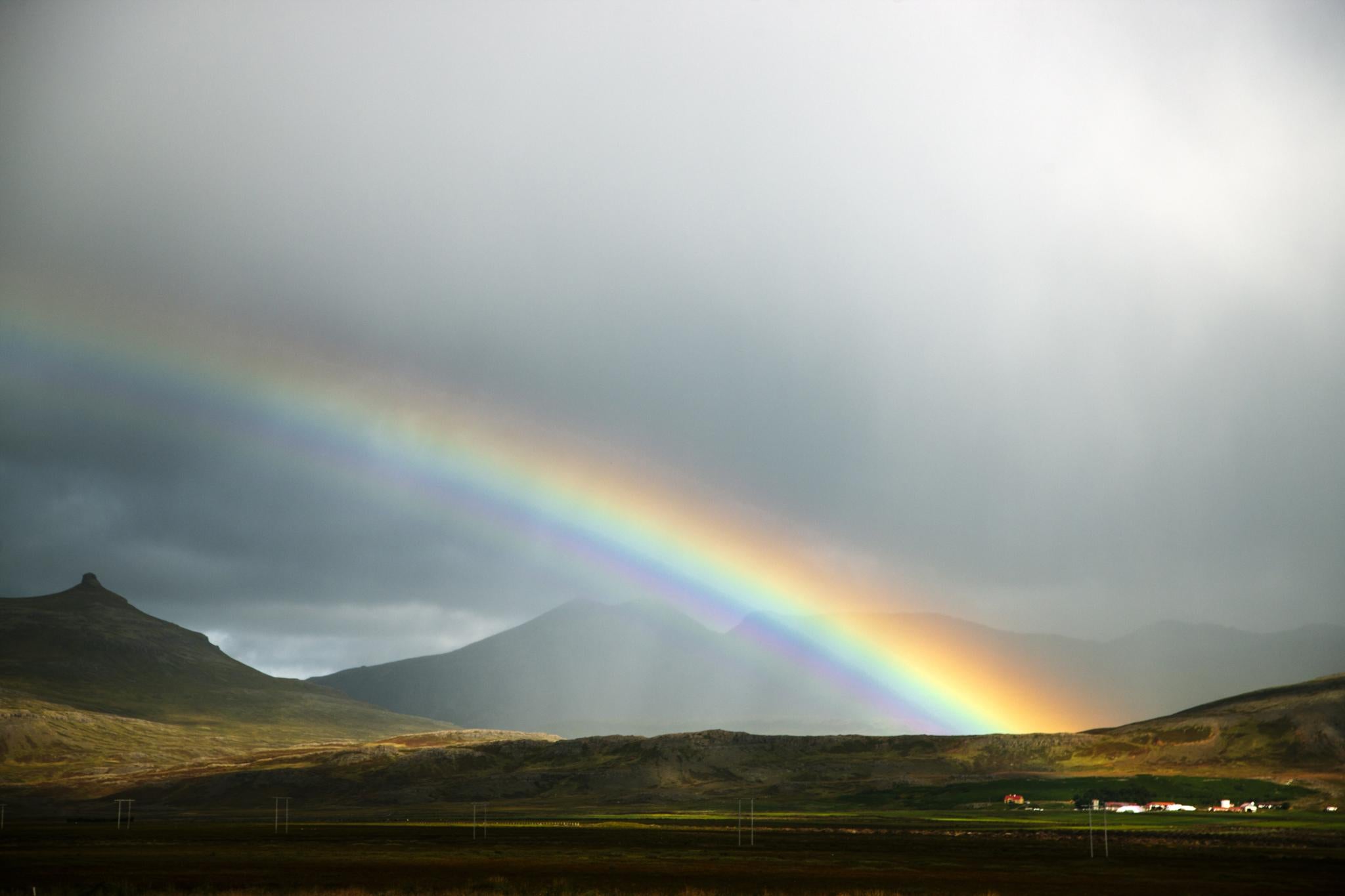 Rainbow over rolling hills