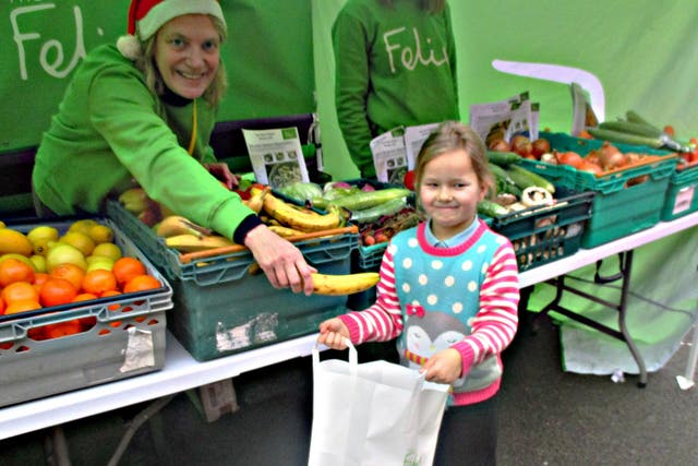 Six-year-old Summer loads up on fruit and vegetables for the school holidays