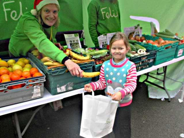 Six-year-old Summer loads up on fruit and vegetables for the school holidays