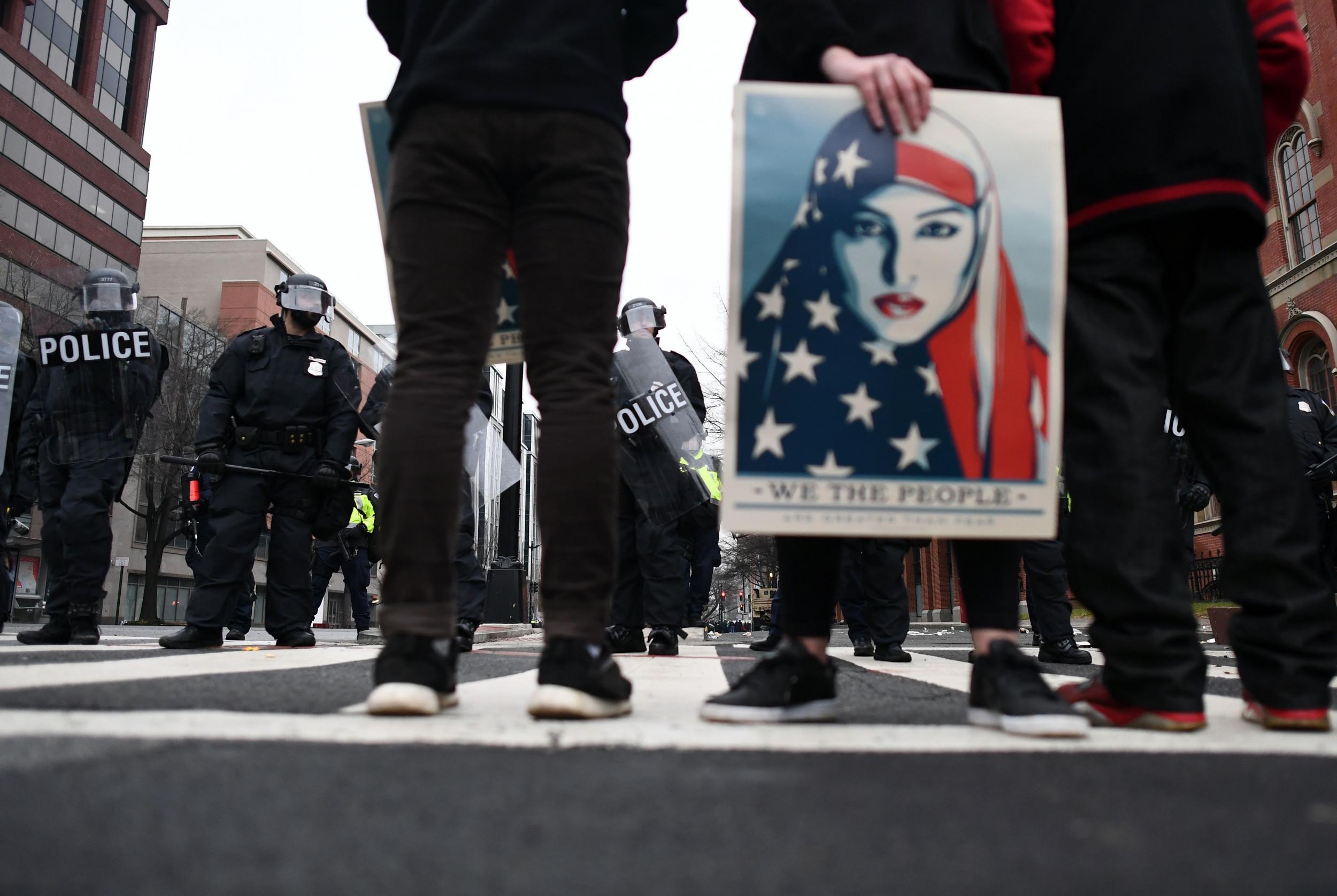 Protestors face off with police in Washington, DC on the day of Donald Trump's election