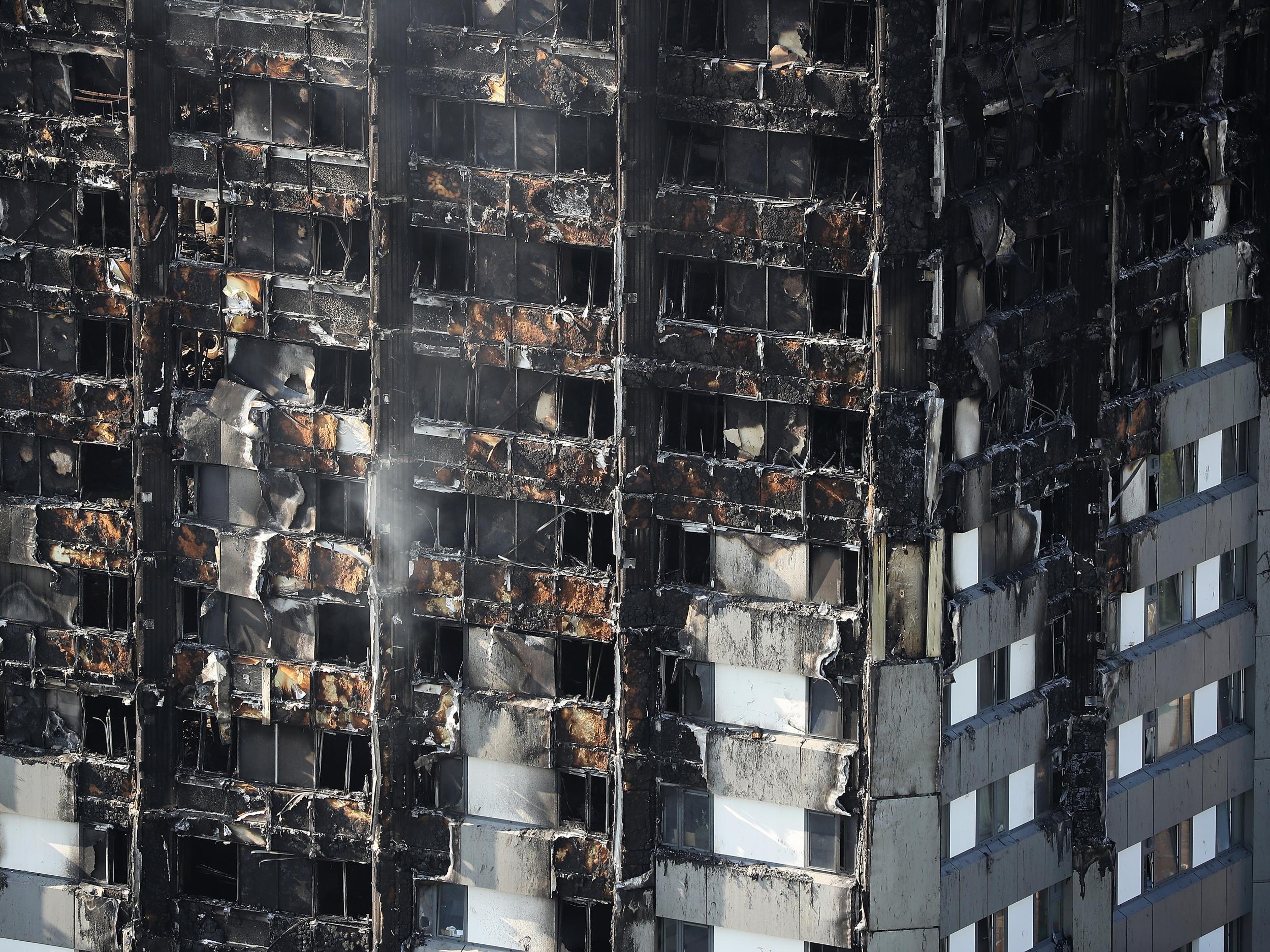 Grenfell Tower continues to smoulder on 15 June 2017