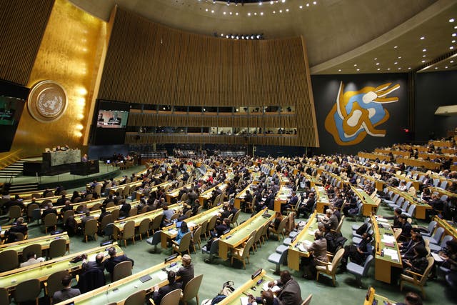 People gather at the United Nations General Assembly prior to the vote