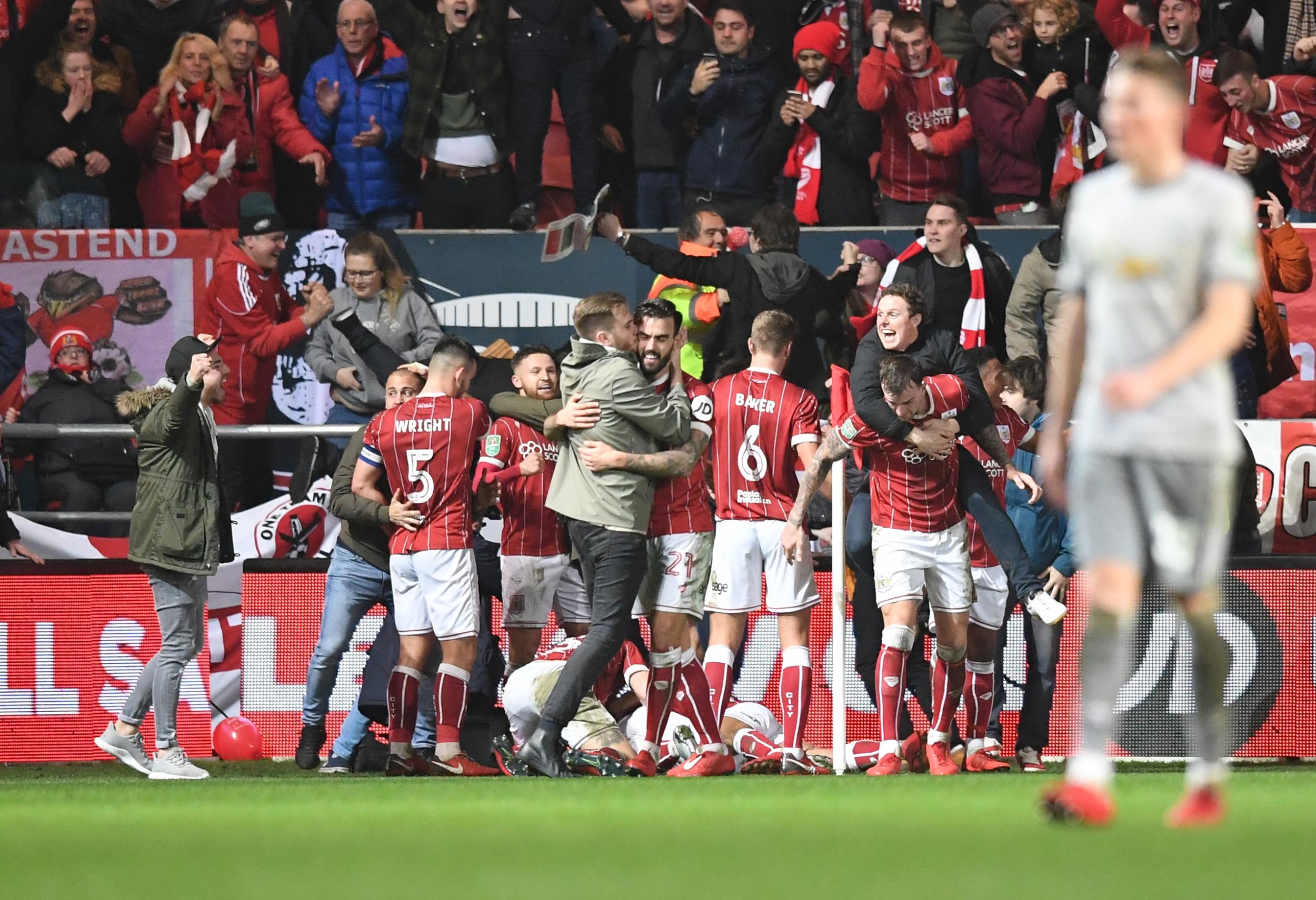 Fans rushed on to the pitch to celebrate the winning goal