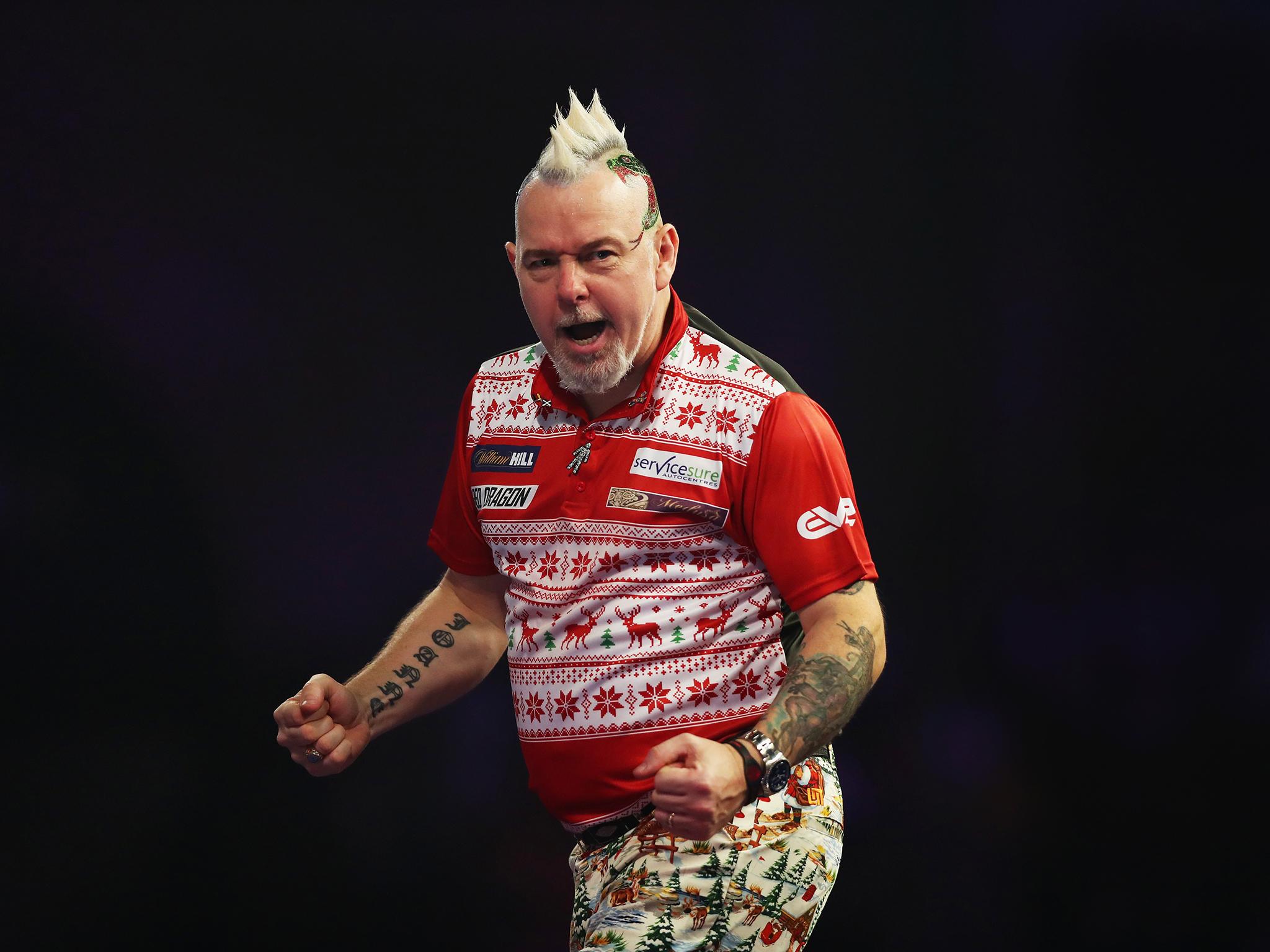 Peter Wright beat Brazilian Diogo Portela to reach the second round at the Darts World Championship