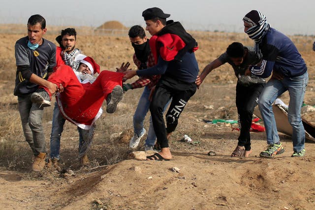 A man dressed as Santa Claus was among those Palestinians injured in southern Gaza