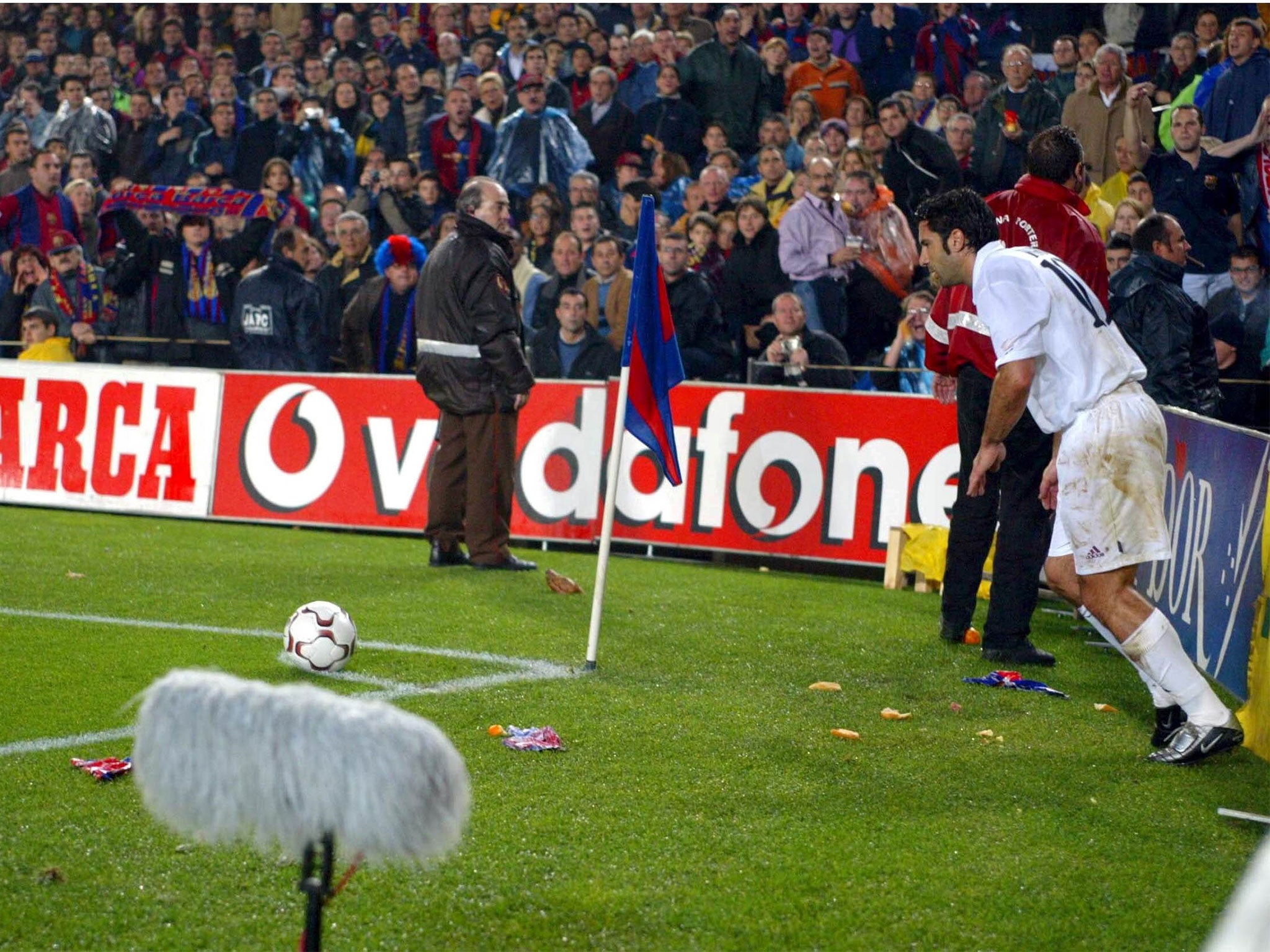 Figo was showered with missiles, including a pig's head, on his return to Barcelona