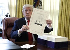 Donald Trump signs $1.5 trillion tax bill into law