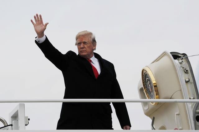President Trump boards Air Force One on his way to Mar-a-Lago on Friday 22 December