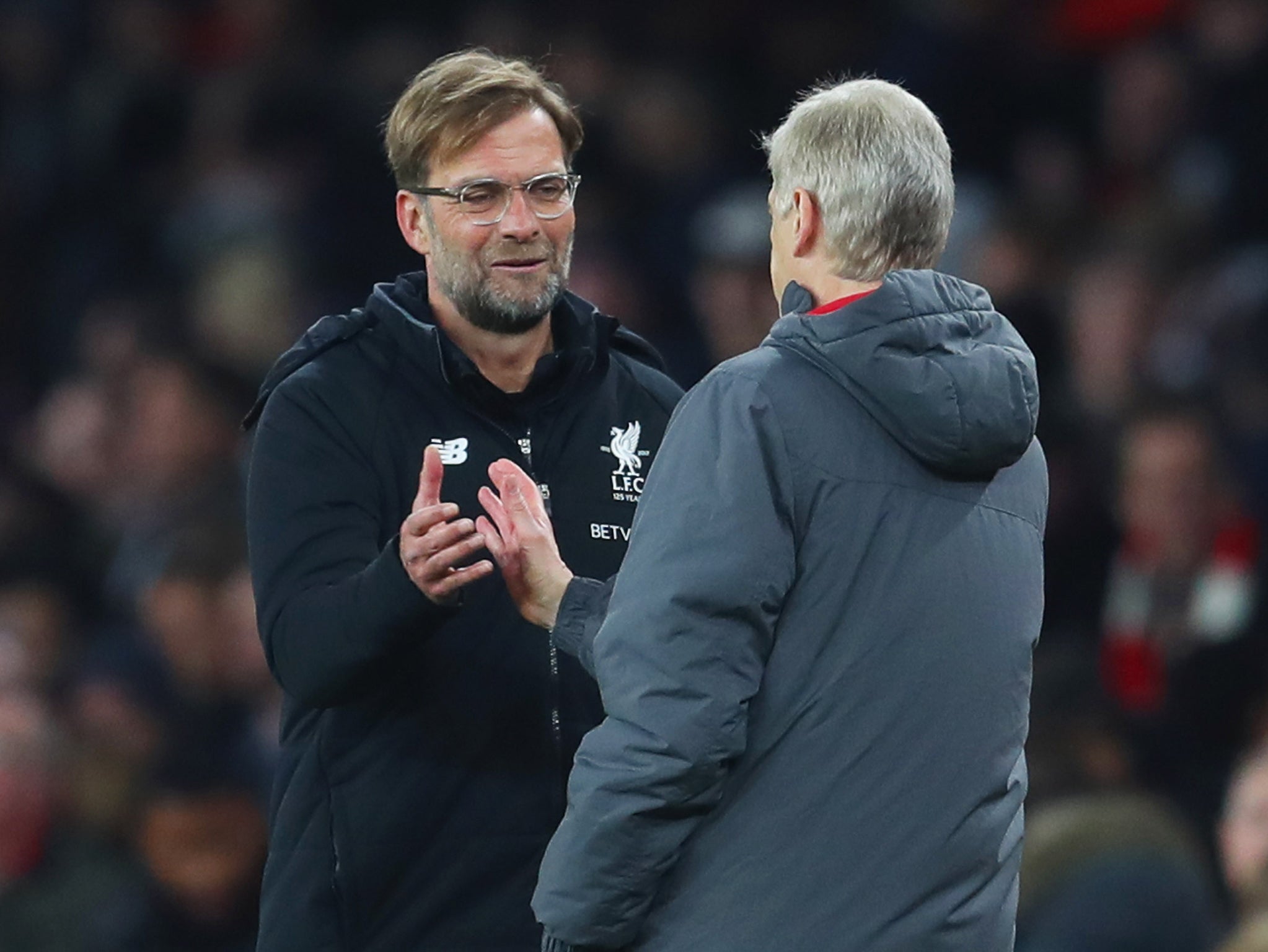 Klopp and Wenger shake hands after the match