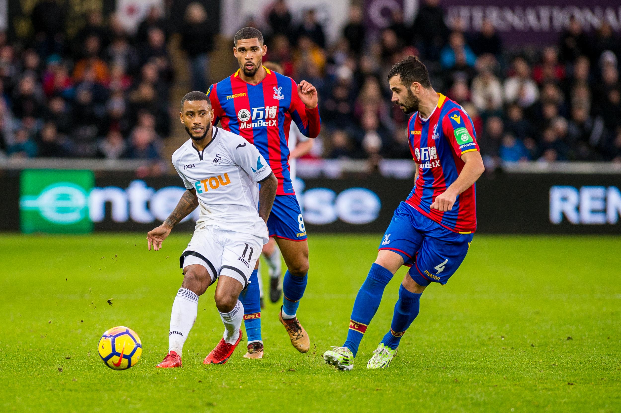 Luciano Narsingh looks to play a pass for Swansea during the first half