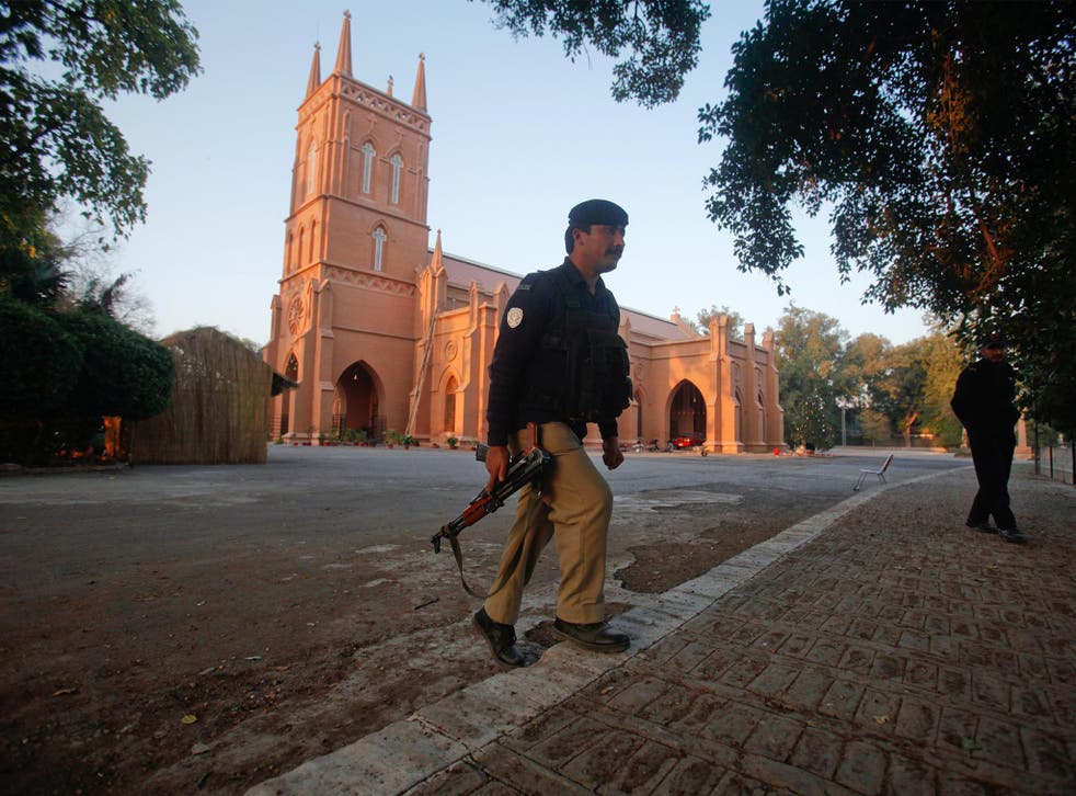 Policeman keeps guard outside a church in Peshawar, Pakistan