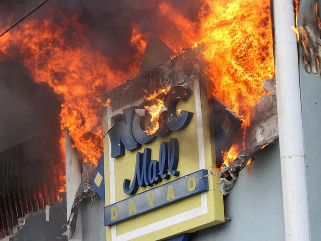 The fire raging at NCCC Mall on Saturday, December 23 in Davao city, southern Philippines