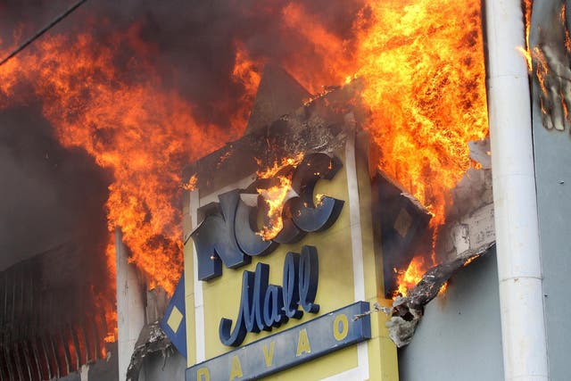 The fire raging at NCCC Mall on Saturday, December 23 in Davao city, southern Philippines