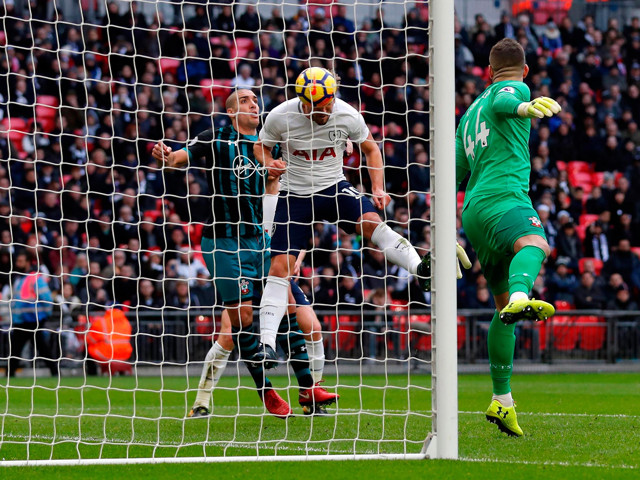 Harry Kane heads in his 37th Premier League goal of the season against Southampton