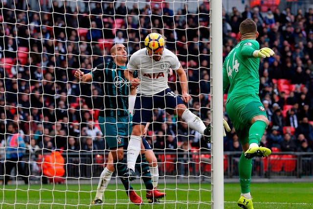 Harry Kane heads in his 37th Premier League goal of the season against Southampton