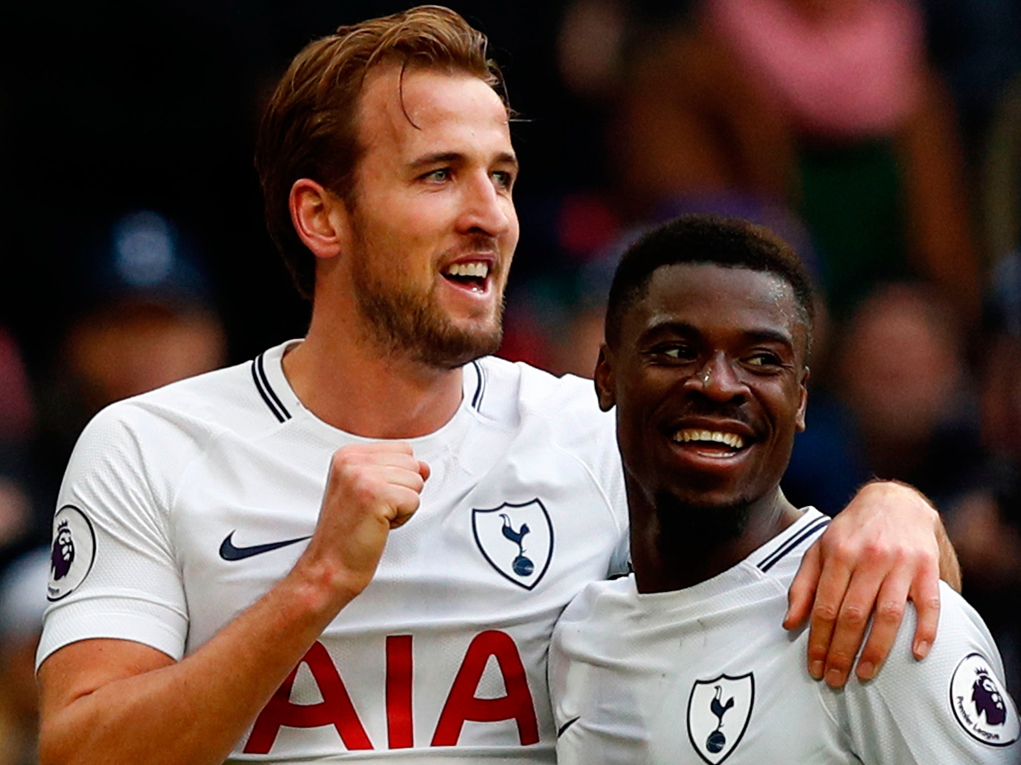 Harry Kane celebrates completing his hat-trick against Southampton with Serge Aurier