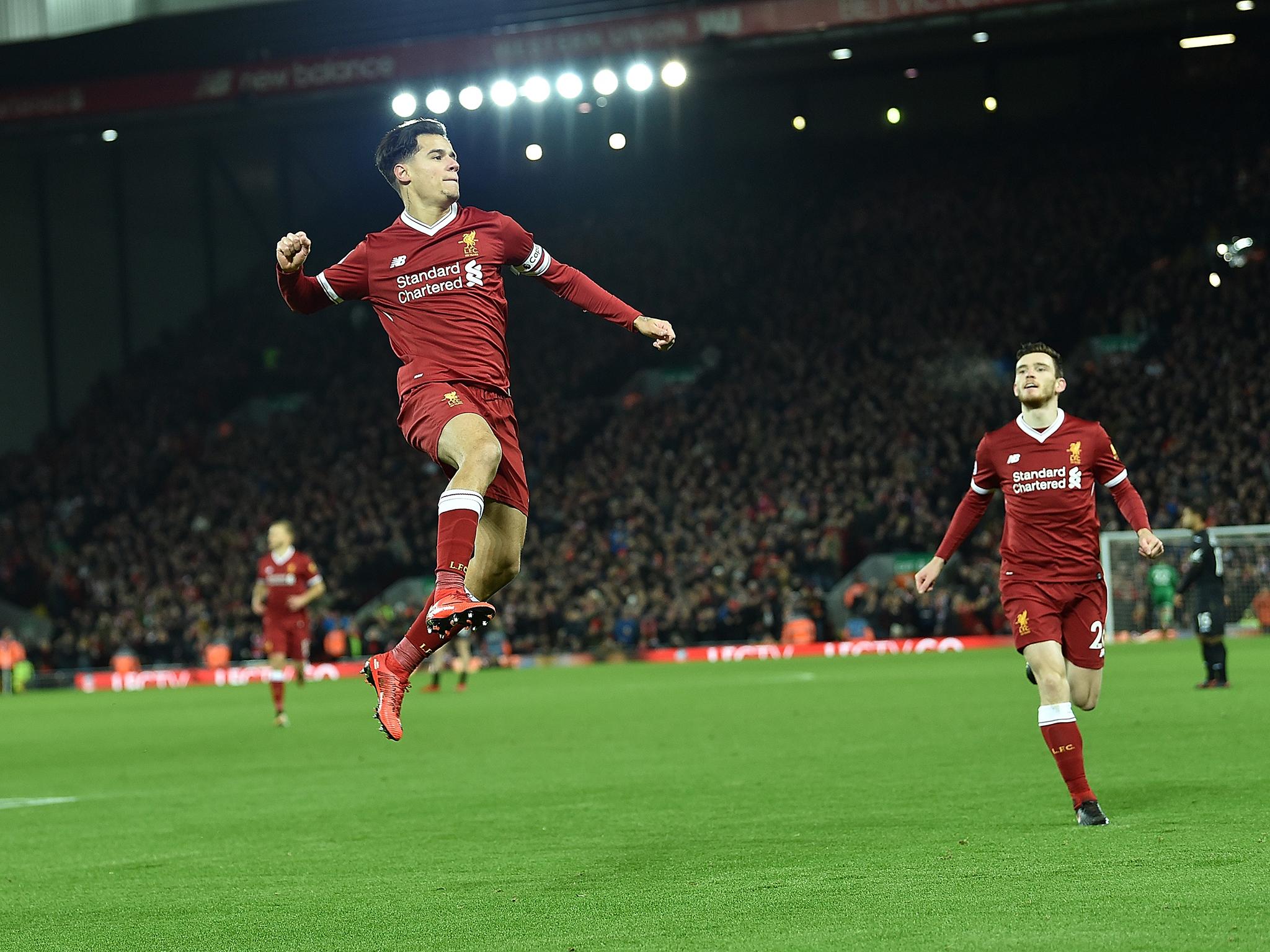 Philippe Coutinho celebrates putting Liverpool ahead of Swansea