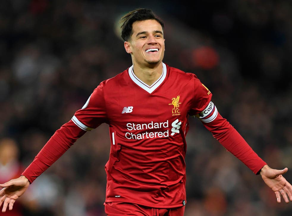 Philippe Coutinho celebrates scoring the opener for Liverpool in the 5-0 thrashing of Swansea