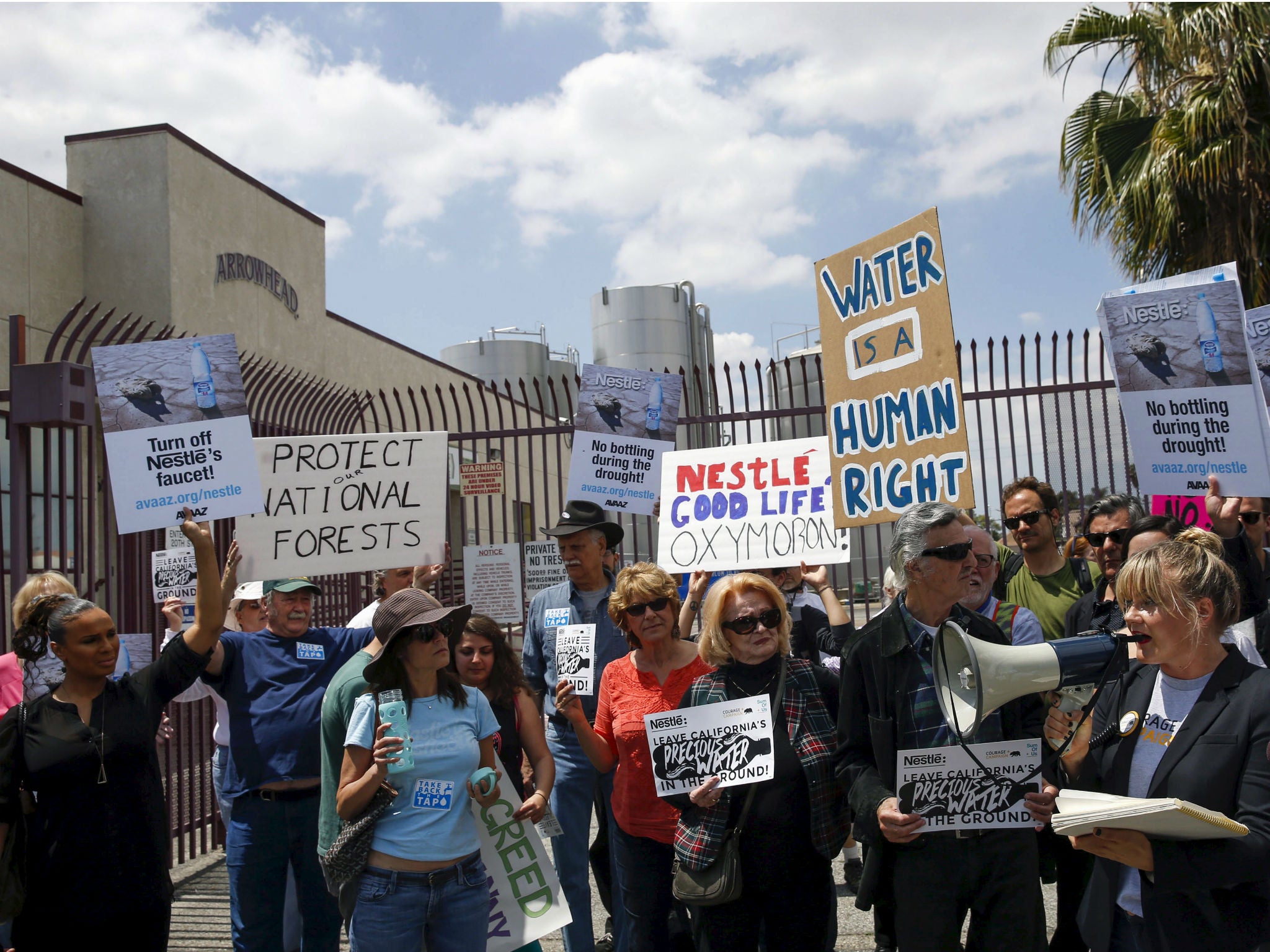 Demonstrators protest against Nestle bottling water during the California drought, outside a Nestle Arrowhead water bottling plant in Los Angeles