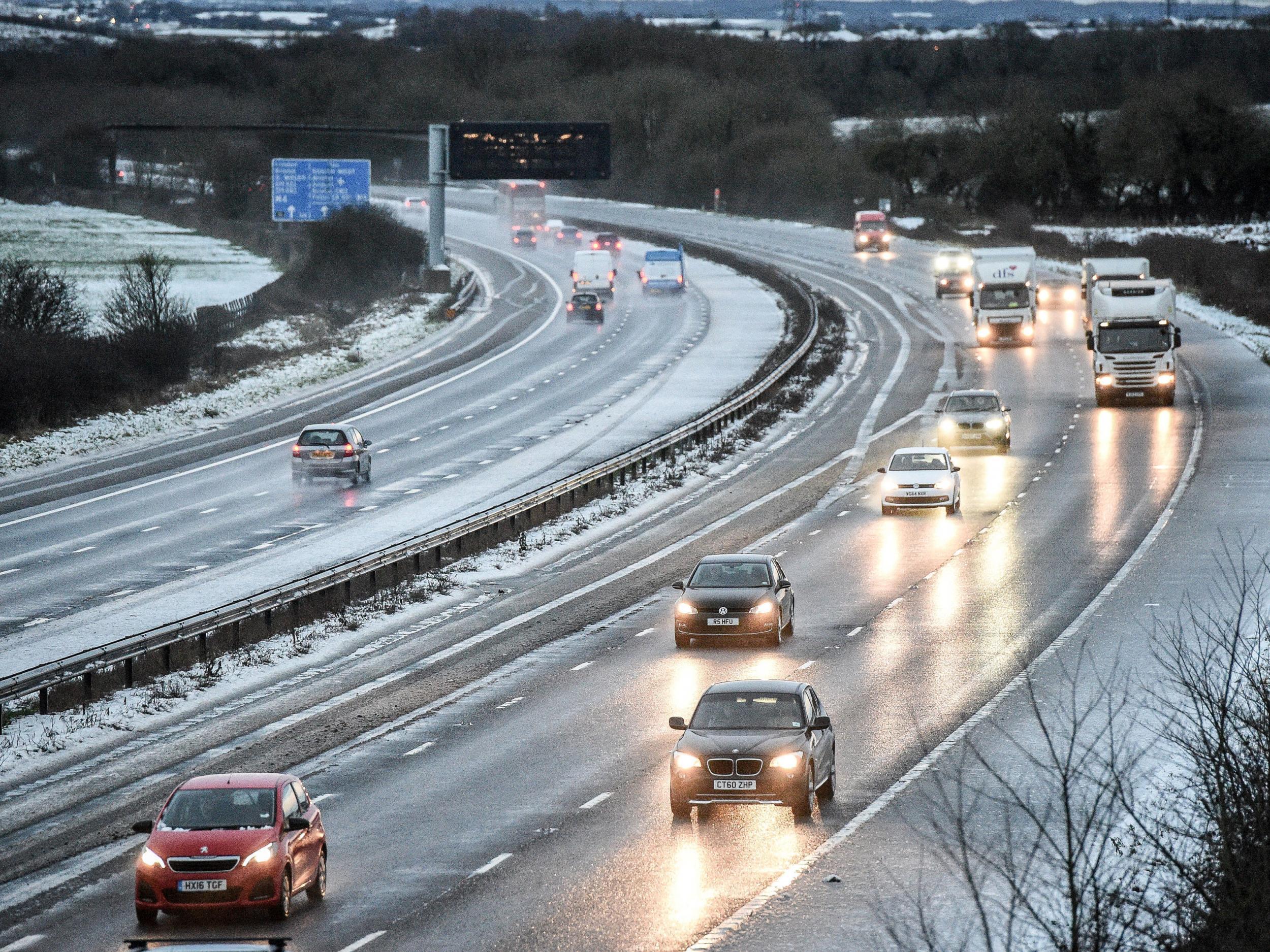 Snow reduces the M5 motorway down to two lanes between junction 14 and 15 in South Gloucestershire on Wednesday