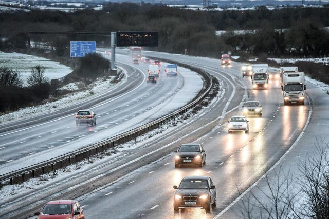 Snow reduces the M5 motorway down to two lanes between junction 14 and 15 in South Gloucestershire on Wednesday